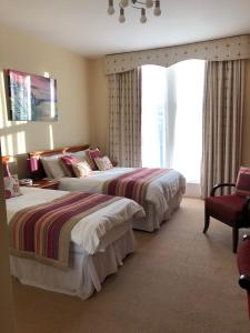 A bed or beds in a room at The Burleigh 