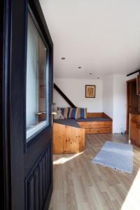 a bedroom with a bed and a sliding glass door at Morgensonne in Hiddensee