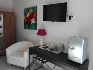 TV a/nebo společenská místnost v ubytování B&B Il Belvedere