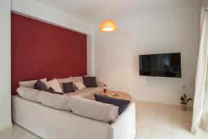 a living room with a couch and a table at Angel-kolymvari4you in Kolymvari
