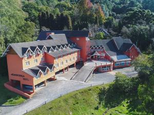 an aerial view of a large building with red at Hotel Renascença By Rede Elevare in Gramado