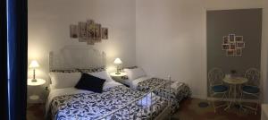 A bed or beds in a room at MiRhome Guest House