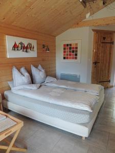 מיטה או מיטות בחדר ב-Au Bout du Chemin