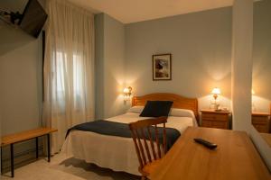 Posteľ alebo postele v izbe v ubytovaní Hotel Villa del Son