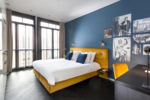 Кровать или кровати в номере Court Hotel Utrecht City Centre