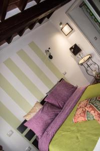 Säng eller sängar i ett rum på Antica Dimora del Pellegrino