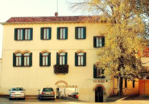 a building with cars parked in front of it at Cà Doge in Venice