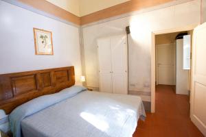 A bed or beds in a room at Bilo Sant'Anna con vista piscina