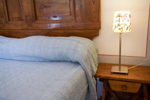 A bed or beds in a room at Bilo Sant'Anna con vista piscina