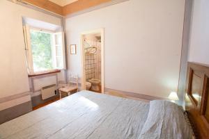 A bed or beds in a room at Bilo Sant'Anna con vista piscina