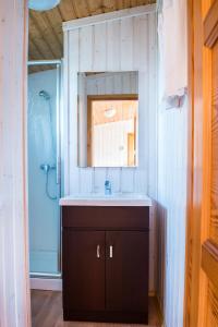 a bathroom with a sink and a shower at Camping Raco in Benidorm