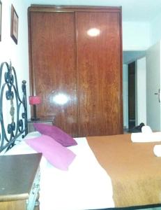 Ein Bett oder Betten in einem Zimmer der Unterkunft Apartamento Sagrada Familia