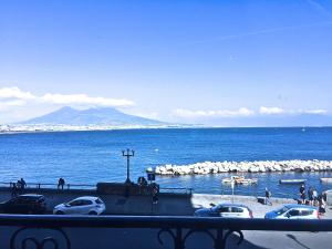 a view of a large body of water with cars parked at Residenza Santa Lù B&B in Naples