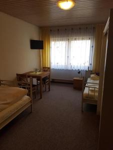 Postel nebo postele na pokoji v ubytování Eiscafé - Pizzeria Antonio
