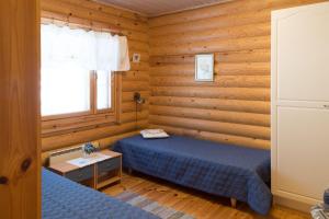 Ένα ή περισσότερα κρεβάτια σε δωμάτιο στο Hiekkarannanlomat