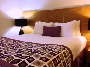 Postel nebo postele na pokoji v ubytování Hotel Aladino