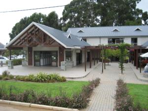 a building with a gambrel roof on top of it at Stay@67 Apartments - Dullstroom in Dullstroom