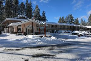 a building covered in snow with cars parked in front at Bluelake Inn @ Heavenly Village in South Lake Tahoe