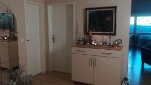 a living room with a dresser and a window at Zimmervermietung Bern in Bern