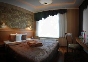 מיטה או מיטות בחדר ב-Villa Solankowa