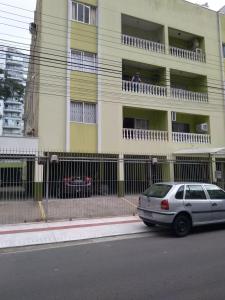 a white car parked in front of a building at Hospedagem da Grega in Balneário Camboriú +13 photos