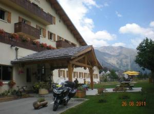 a motorcycle parked in front of a building at Le Collet d'Auron in Auron