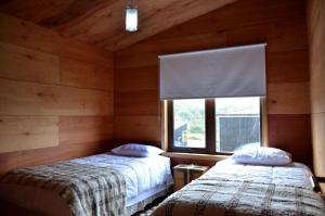 Cama o camas de una habitación en Cabañas Alen Mapu