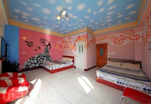 Postel nebo postele na pokoji v ubytování Green island Breeze Homestay + 1 fotografie