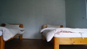 Postelja oz. postelje v sobi nastanitve Peace Guest House