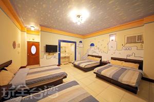 Postel nebo postele na pokoji v ubytování Green island Breeze Homestay