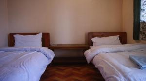 Postelja oz. postelje v sobi nastanitve Peace Guest House