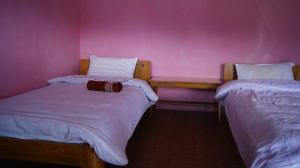 Postelja oz. postelje v sobi nastanitve Peace Guest House