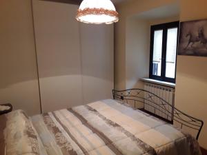Voodi või voodid majutusasutuse Dentro le mura toas
