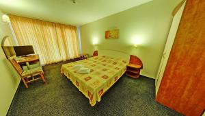 A bed or beds in a room at Hotel Exotica