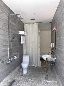 a bathroom with a toilet and a sink and a shower at Chill Chill House in Shimen District +71 photos