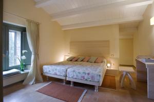 Кровать или кровати в номере La Capanna di Castell'in Villa