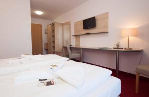 Postel nebo postele na pokoji v ubytování Hotel 3 Linden