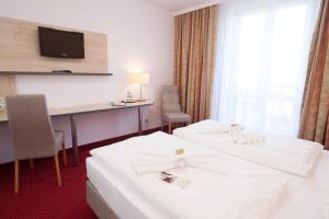 Postel nebo postele na pokoji v ubytování Hotel 3 Linden