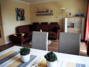 Posezení v ubytování Haus Aquamarina - FeWo mit Balkon