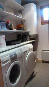 a laundry room with a washing machine in it at Chalet Notre Retraite in Ventron