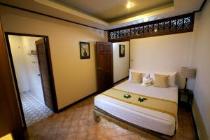 a bedroom with a large white bed in a room at Smile House - Fisherman Village in Bophut