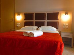 Ένα ή περισσότερα κρεβάτια σε δωμάτιο στο Gaia Studios & Apartments