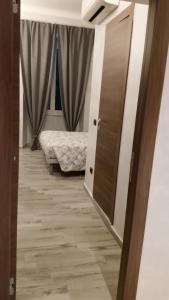 Postel nebo postele na pokoji v ubytování Ricci Rooms