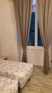 Postel nebo postele na pokoji v ubytování Ricci Rooms