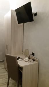 TV a/nebo společenská místnost v ubytování Ricci Rooms