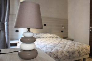 Postel nebo postele na pokoji v ubytování Ricci Rooms