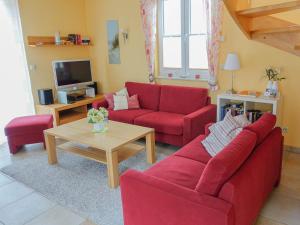 TV a/nebo společenská místnost v ubytování Ferienhaus Godewind Glowe