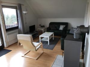 a living room with a couch and a table at Frankenau 237/239 in Frankenau