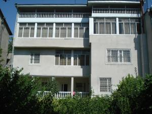 a large white building with barred windows at Royal Boutique Hotel on Kievyan in Yerevan