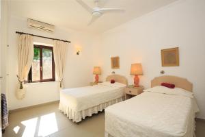 Posteľ alebo postele v izbe v ubytovaní Villa Quietude + 37 fotografií